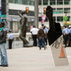 A man takes a selfie with Hank Willis Thomas’ All Power to All People sculpture in view of a statue of former Philadelphia Mayor and Police Commissioner Frank Rizzo in Philadelphia on Sept. 14, 2017.